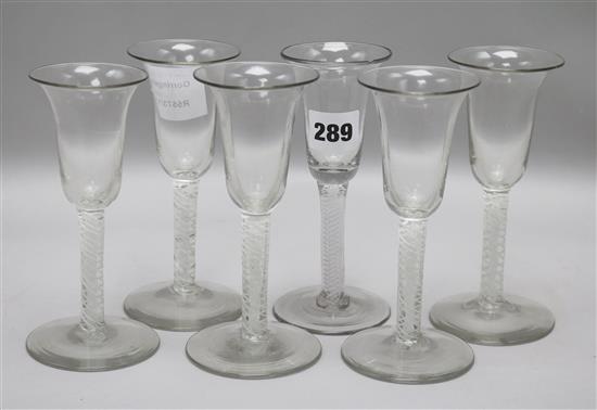 A set of six wine glasses, with bell shaped bowls and opaque twist stems 15cm